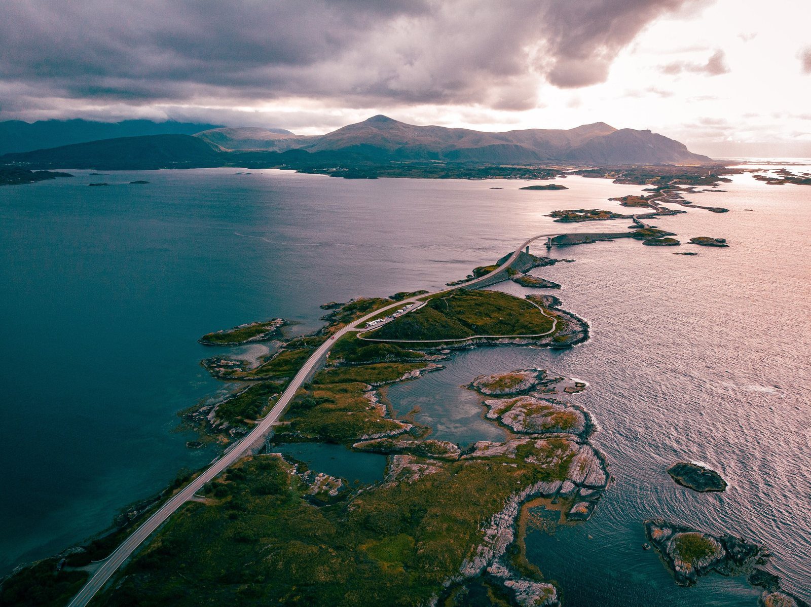 Aerial view of the Atlantic Ocean Road in Norway winding across islands towards the horizon