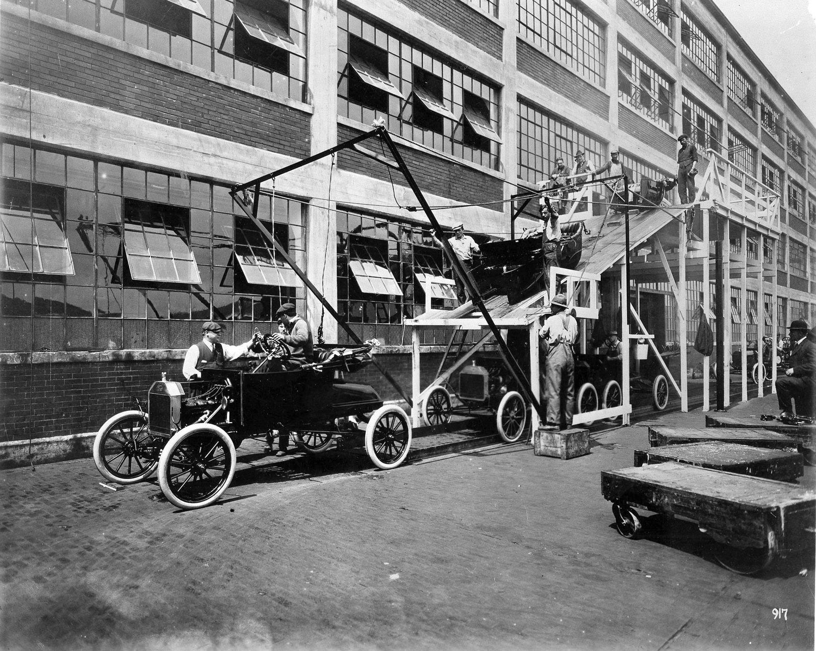 A Model T body being lowered onto its chassis at Ford’s Highland Park plant in 1913
