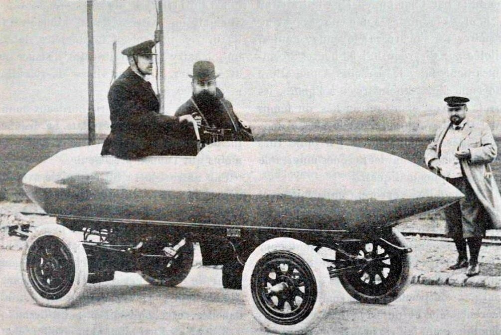 Camille Jenatzy at the wheel of La Jamais Contente, a torpedo-shaped electric car, in 1899
