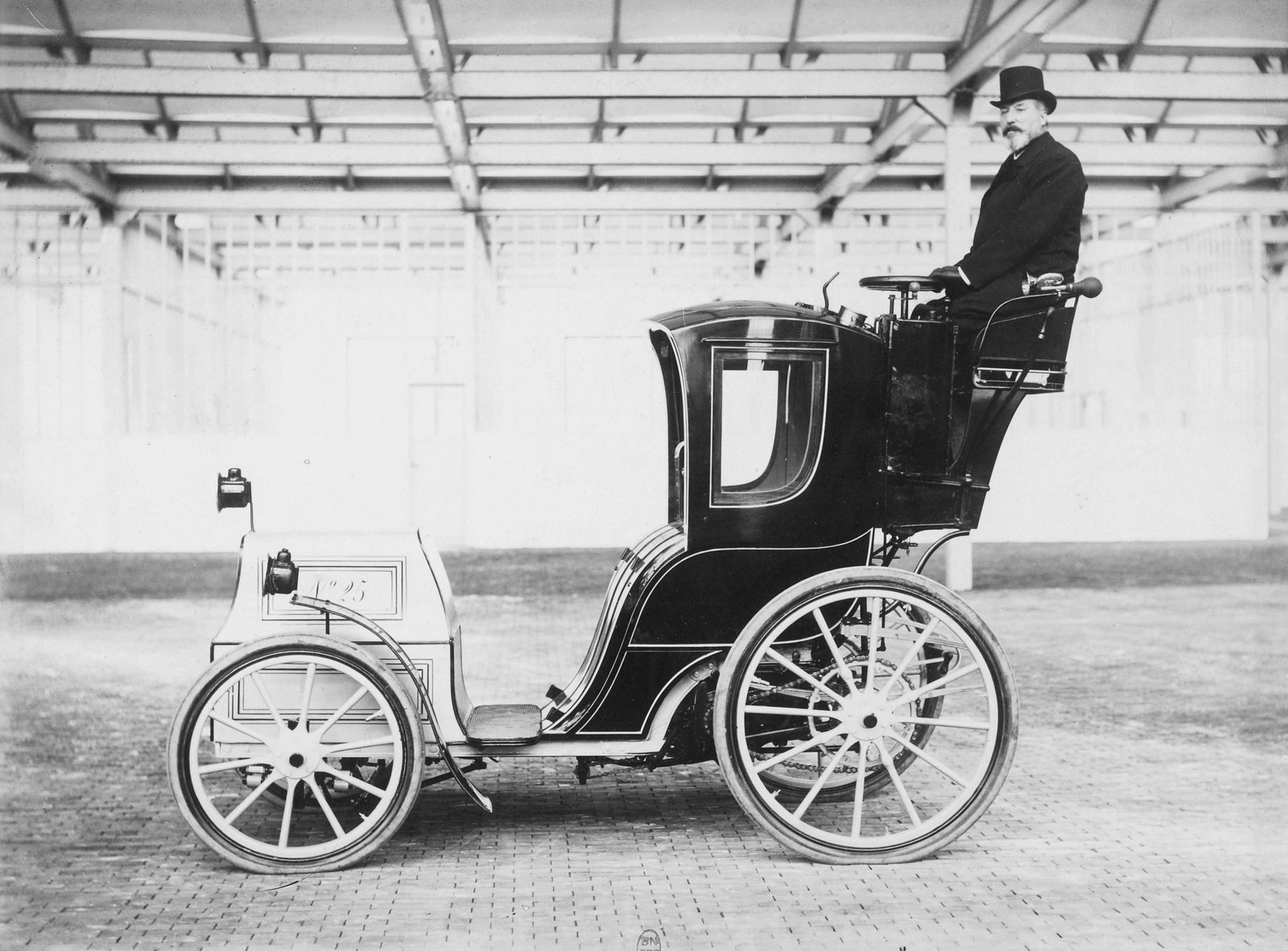 A Jeantaud electric cab with its driver, photographed in Paris in 1898